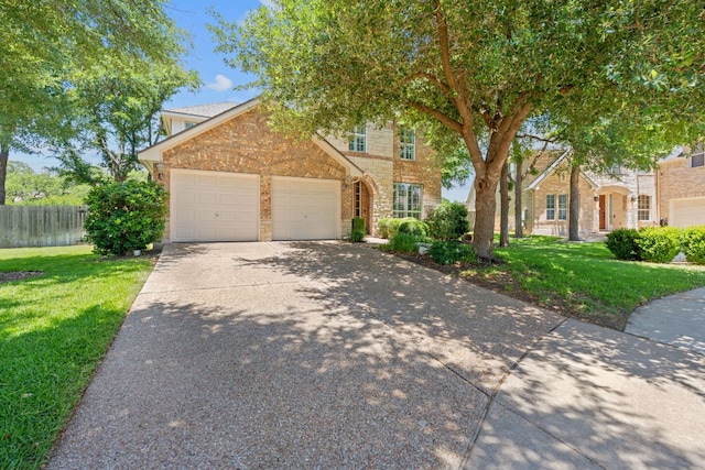 2634 Plantation Dr, Round Rock, TX 78681 - view of front of house featuring driveway, an attached garage, and stone siding