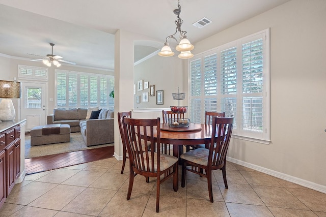2634 Plantation Dr, Round Rock, TX 78681 - dining space featuring plenty of natural light, crown molding, ceiling fan, and light tile patterned flooring