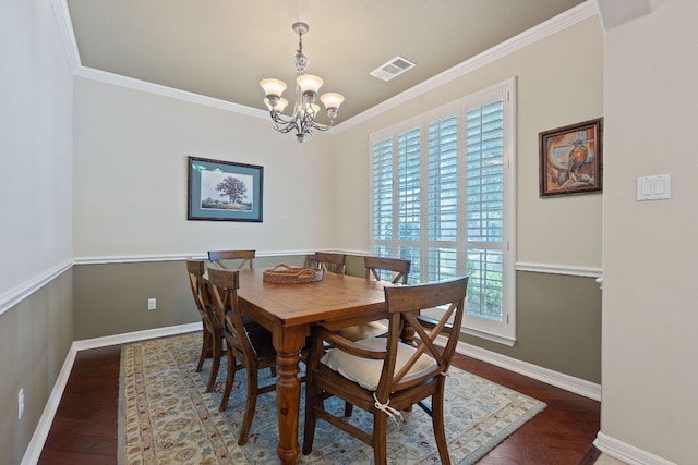 2634 Plantation Dr, Round Rock, TX 78681 - dining area with a chandelier, crown molding, and wood finished floors
