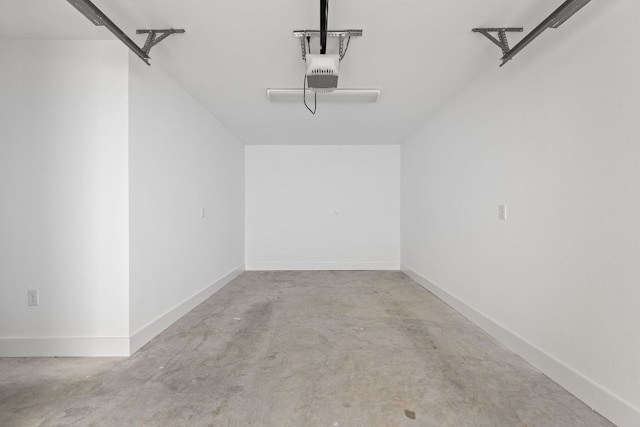 2813 Prado Unit 2, Austin, TX 78702 - garage featuring a garage door opener and baseboards