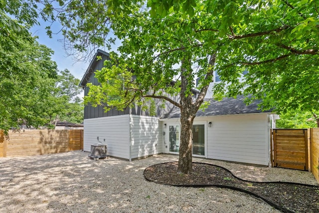 2813 Prado Unit 2, Austin, TX 78702 - back of house with a fenced backyard, board and batten siding, and a patio area
