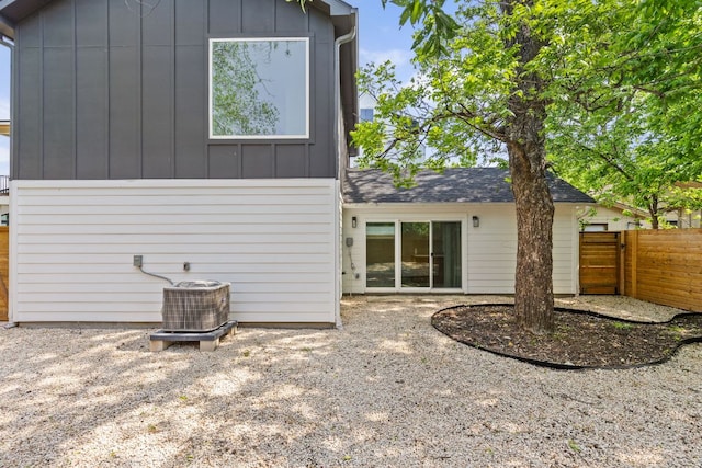 2813 Prado Unit 2, Austin, TX 78702 - back of house with board and batten siding and roof with shingles