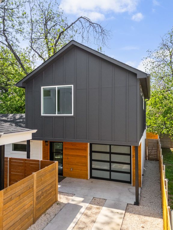 2813 Prado Unit 2, Austin, TX 78702 - modern home featuring board and batten siding, concrete driveway, and an attached garage