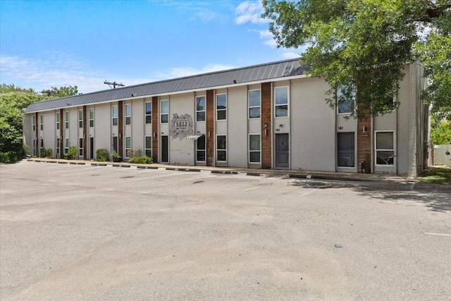 3812 Southway Dr Unit 103, Austin, TX 78704 - view of building exterior featuring uncovered parking