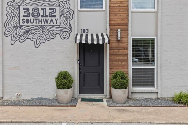 3812 Southway Dr Unit 103, Austin, TX 78704 - view of exterior entry with brick siding