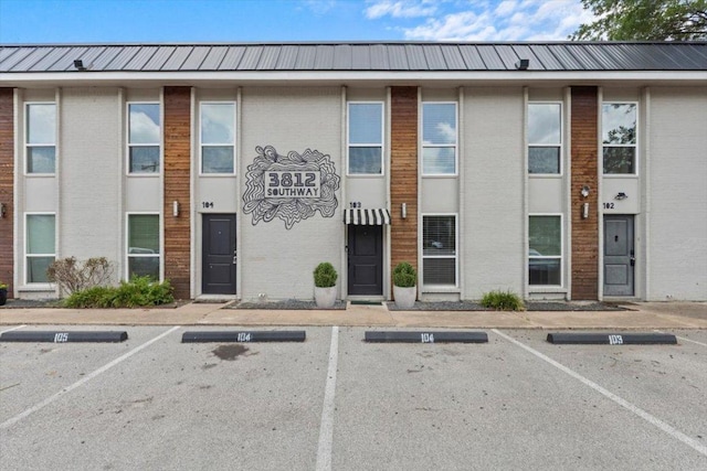 3812 Southway Dr Unit 103, Austin, TX 78704 - view of building exterior featuring uncovered parking
