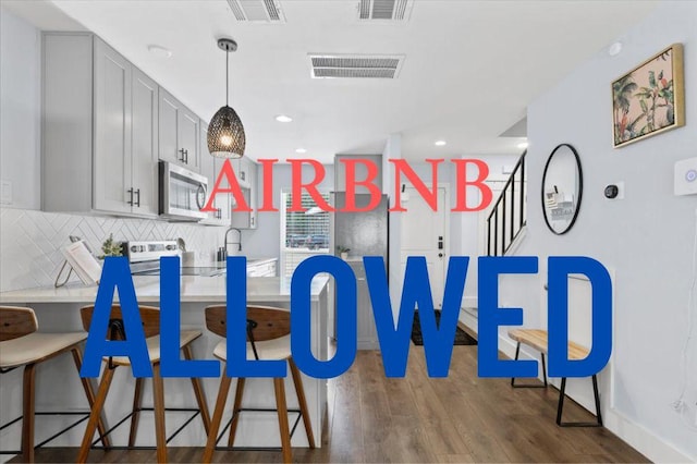 3812 Southway Dr Unit 103, Austin, TX 78704 - dining space with wood finished floors, recessed lighting, and stairway