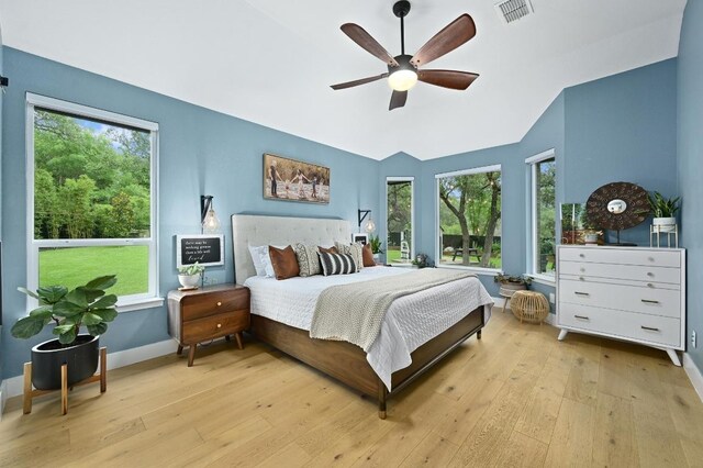 3703 Runnels Ct, Austin, TX 78732 - bedroom with hardwood / wood-style floors, multiple windows, lofted ceiling, and a ceiling fan
