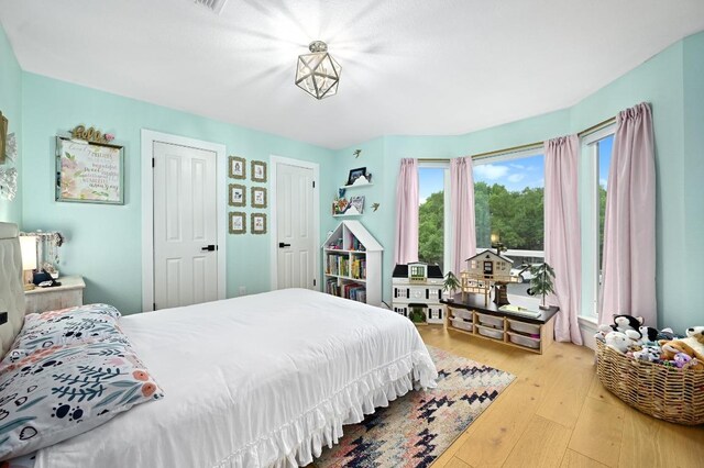 3703 Runnels Ct, Austin, TX 78732 - bedroom with hardwood / wood-style flooring