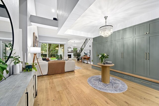 3703 Runnels Ct, Austin, TX 78732 - entrance foyer featuring a chandelier and light wood-type flooring