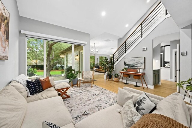 3703 Runnels Ct, Austin, TX 78732 - living area with a chandelier, wood finished floors, and recessed lighting
