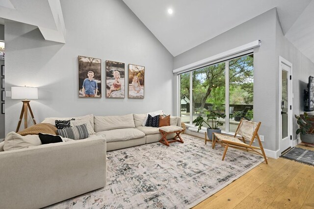 3703 Runnels Ct, Austin, TX 78732 - living room featuring wood-type flooring, high vaulted ceiling, and recessed lighting