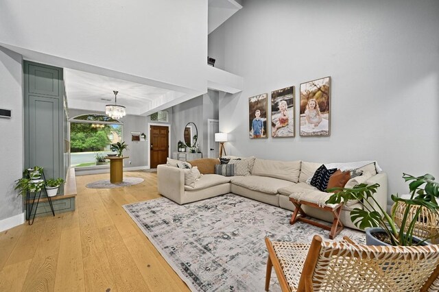 3703 Runnels Ct, Austin, TX 78732 - living area featuring a chandelier and light wood finished floors
