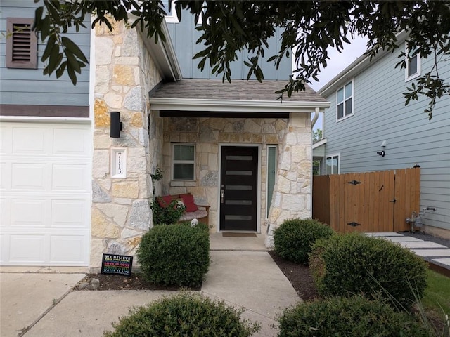 7113 Cherry Beam Path, Austin, TX 78744 - view of exterior entry featuring stone siding and roof with shingles