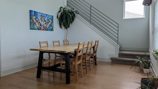 7113 Cherry Beam Path, Austin, TX 78744 - dining area featuring stairway and wood-type flooring