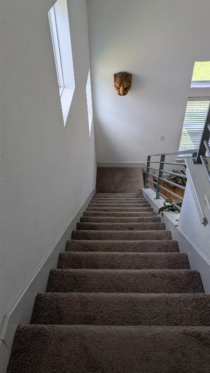 7113 Cherry Beam Path, Austin, TX 78744 - stairway with carpet flooring and baseboards