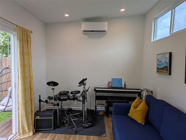 7113 Cherry Beam Path, Austin, TX 78744 - game room with a wall mounted AC, wood finished floors, and recessed lighting