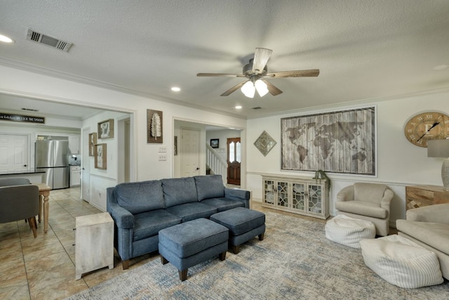 2018 Shadowbrook Cir, Round Rock, TX 78681 - living room featuring crown molding, a ceiling fan, a textured ceiling, stairs, and recessed lighting