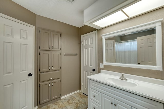 2018 Shadowbrook Cir, Round Rock, TX 78681 - bathroom featuring vanity and baseboards