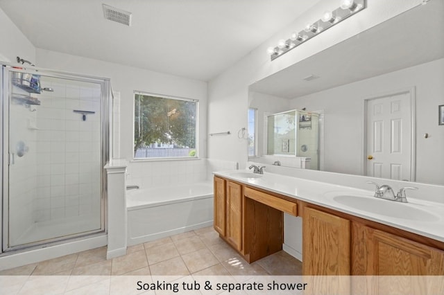 118 Lone Star Blvd, Hutto, TX 78634 - bathroom featuring a shower stall, a garden tub, double vanity, and tile patterned floors