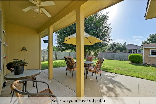 118 Lone Star Blvd, Hutto, TX 78634 - fenced backyard with outdoor dining area, a patio area, and ceiling fan