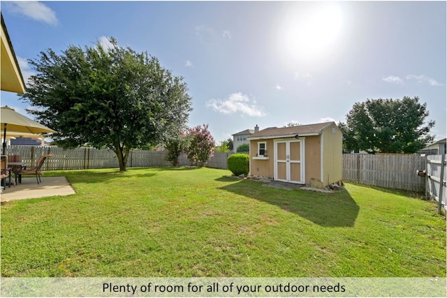 118 Lone Star Blvd, Hutto, TX 78634 - fenced backyard with a storage unit and a patio
