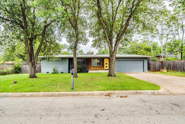 6602 Daugherty St, Austin, TX 78757 - view of front of home with concrete driveway, crawl space, and a garage