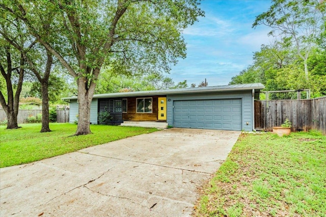 6602 Daugherty St, Austin, TX 78757 - mid-century inspired home featuring concrete driveway and an attached garage