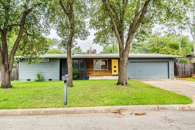 6602 Daugherty St, Austin, TX 78757 - view of front facade featuring crawl space, driveway, and a garage