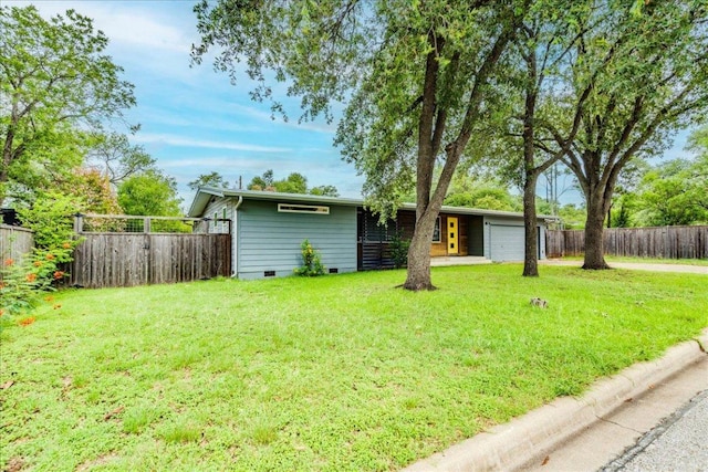 6602 Daugherty St, Austin, TX 78757 - fenced backyard with an attached garage and driveway