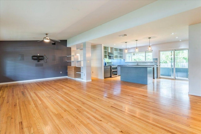 6602 Daugherty St, Austin, TX 78757 - unfurnished living room with light wood-style floors, a ceiling fan, and recessed lighting