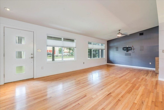 6602 Daugherty St, Austin, TX 78757 - unfurnished living room with ceiling fan and light wood finished floors