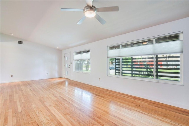 6602 Daugherty St, Austin, TX 78757 - empty room with wood finished floors, lofted ceiling, and a ceiling fan