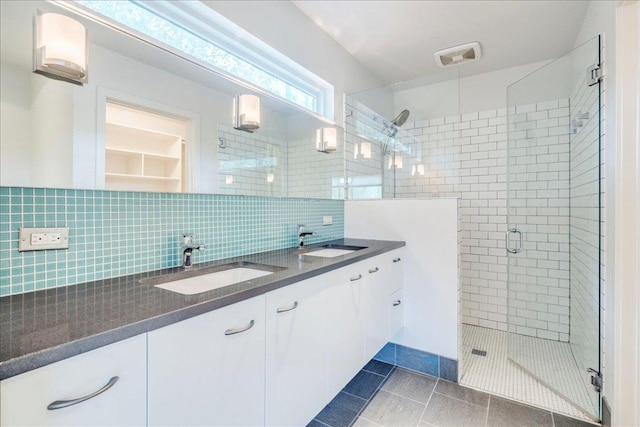 6602 Daugherty St, Austin, TX 78757 - full bathroom with a stall shower, decorative backsplash, double vanity, and tile patterned flooring