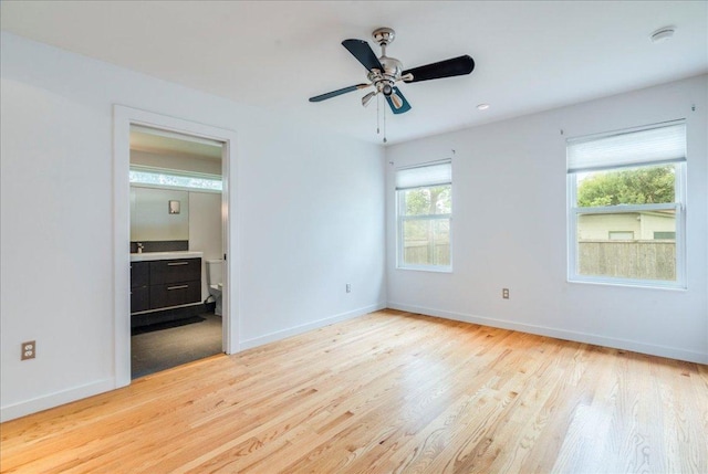 6602 Daugherty St, Austin, TX 78757 - empty room with plenty of natural light, a smoke detector, light wood-type flooring, and ceiling fan
