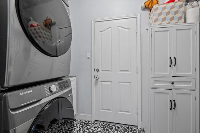2108 Ariella Dr, Cedar Park, TX 78613 - laundry area with stacked washing machine and dryer, cabinet space, and tile patterned floors