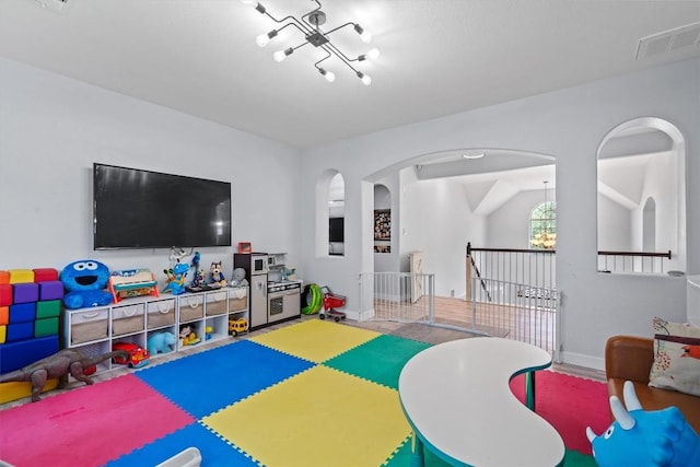 2108 Ariella Dr, Cedar Park, TX 78613 - rec room featuring a chandelier and arched walkways
