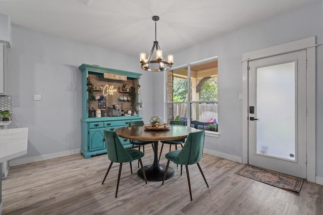 2108 Ariella Dr, Cedar Park, TX 78613 - dining space with light wood-type flooring and a chandelier
