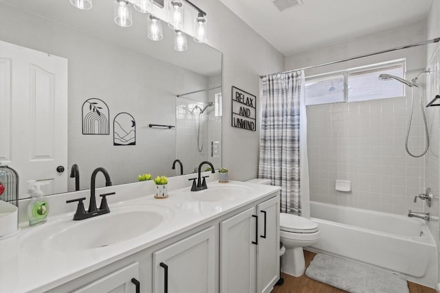 2108 Ariella Dr, Cedar Park, TX 78613 - bathroom with shower / bath combo, double vanity, and wood finished floors