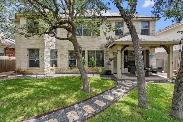 2108 Ariella Dr, Cedar Park, TX 78613 - view of front of home featuring roof mounted solar panels, an outdoor living space, stone siding, and a patio area