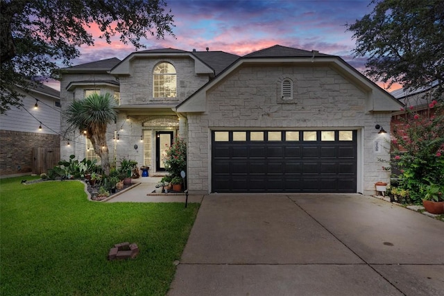 2108 Ariella Dr, Cedar Park, TX 78613 - view of front of house featuring stone siding, a garage, driveway, and a front lawn
