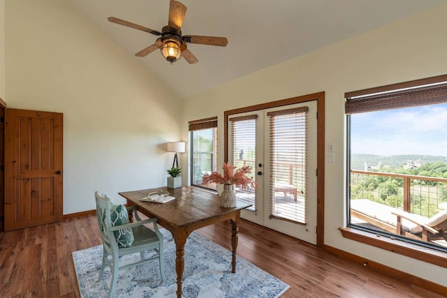 8152 Breeze Way, Jonestown, TX 78645 - office area featuring wood finished floors, ceiling fan, french doors, and high vaulted ceiling