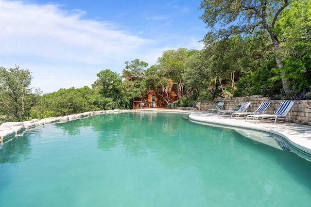 8152 Breeze Way, Jonestown, TX 78645 - swimming pool with a patio area