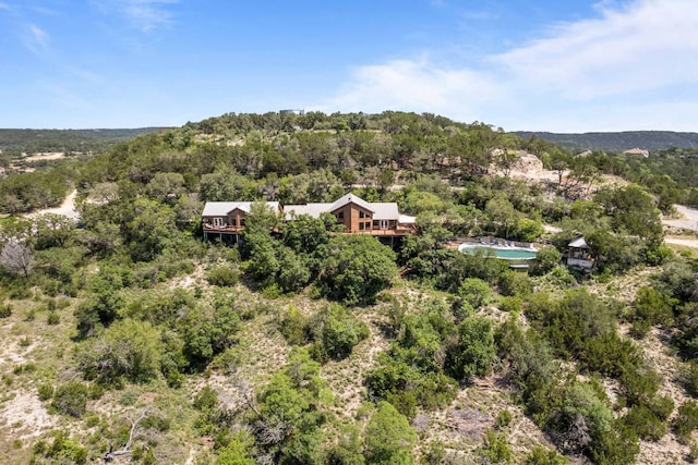 8152 Breeze Way, Jonestown, TX 78645 - aerial view of property and surrounding area with a heavily wooded area