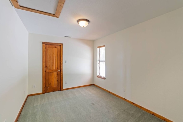 8152 Breeze Way, Jonestown, TX 78645 - unfurnished room featuring light carpet and attic access