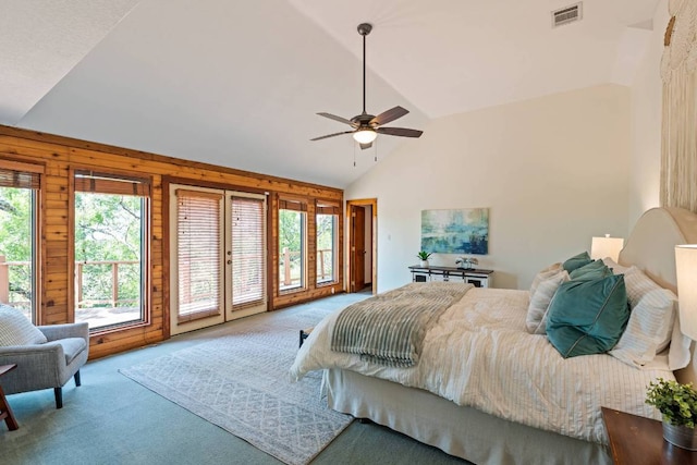8152 Breeze Way, Jonestown, TX 78645 - bedroom with vaulted ceiling, carpet flooring, wood walls, access to outside, and a ceiling fan