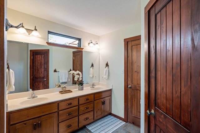 8152 Breeze Way, Jonestown, TX 78645 - bathroom featuring double vanity and tile patterned floors