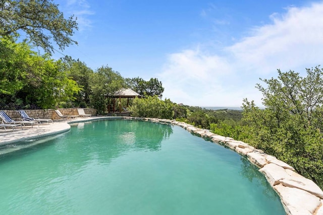 8152 Breeze Way, Jonestown, TX 78645 - outdoor pool with a gazebo and a patio area