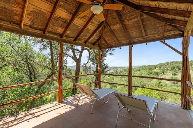 8152 Breeze Way, Jonestown, TX 78645 - unfurnished sunroom featuring ceiling fan, vaulted ceiling, and a view of trees