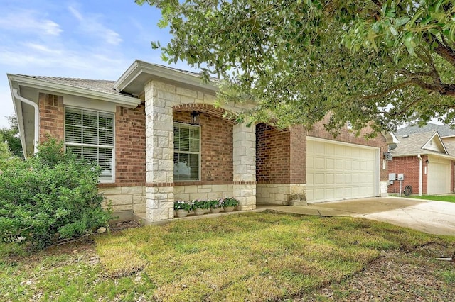 20209 Harrier Flight Trl, Pflugerville, TX 78660 - view of front of property with a garage, driveway, and brick siding
